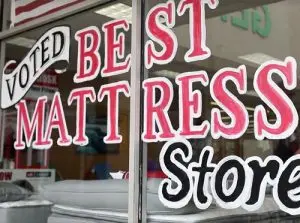 Voted Best Mattress Store sign in the Trent Bedding window