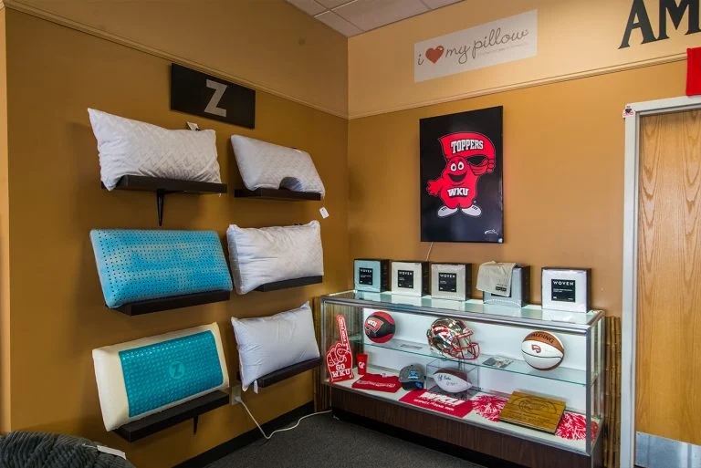 Pillow wall and display case in the Trent Bedding showroom