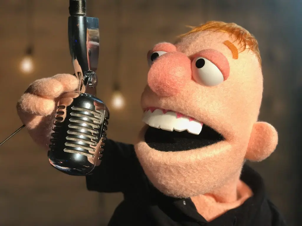 Lil’ Trent singing into a vintage microphone
