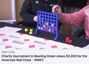 Connect 4 game at a charity tournament for the American Red Cross